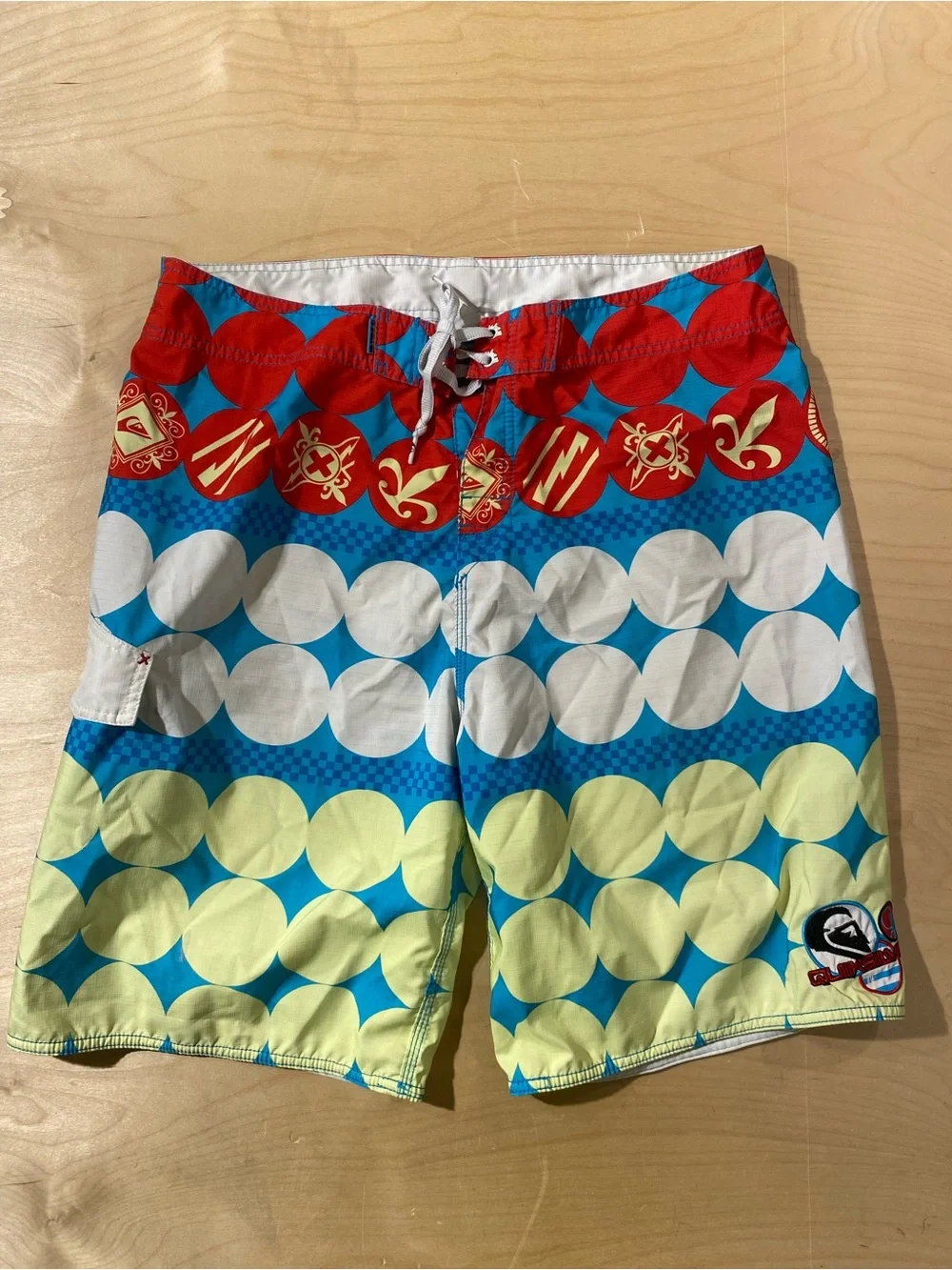 QuikSilver Red, Blue & Yellow Patterned Board Shorts 38 (BM)